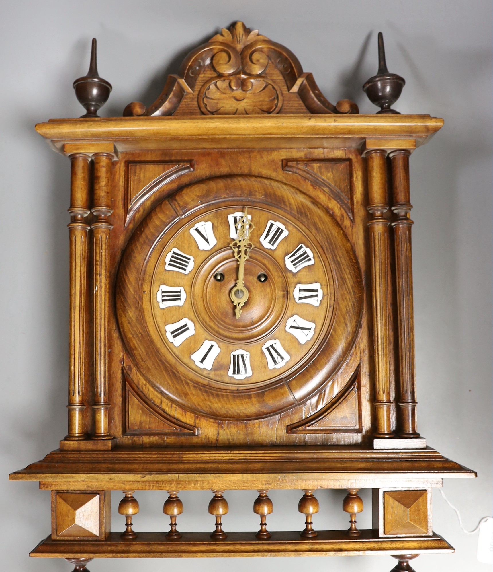 An early 20th century beech Vienna wall clock 69cm